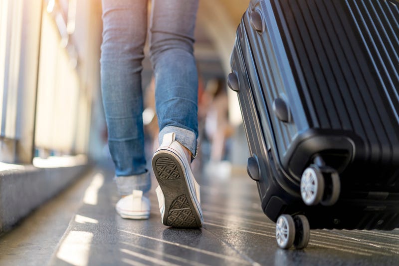 person with suitcase