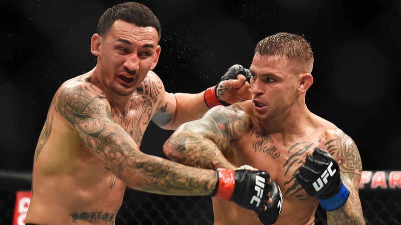 Dustin Poirier lands a right hand on Max Holloway during the main event of UFC 236.