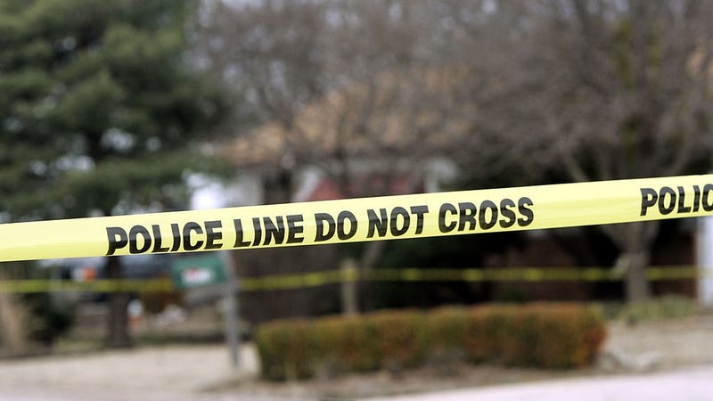 Police tape hangs across the street in front of the house that Dennis Rader lives in February 26, 2005 in Park City, Kansas.