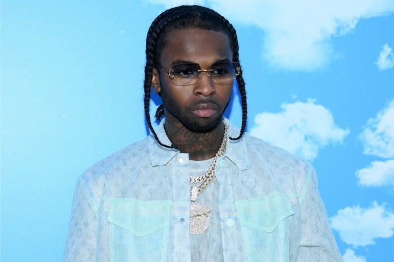 Pop Smoke attends the Louis Vuitton Menswear Fall/Winter 2020-2021 show as part of Paris Fashion Week on January 16, 2020