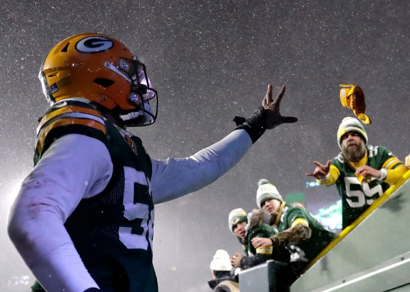 Green Bay Packers outside linebacker Rashan Gary (52) tosses hid game glove to a fan after the Packers 13-10 loss San Francisco 49ers during their NFL divisional round playoff game on Saturday, January 22, 2022, at Lambeau Field in Green Bay, Wis. Wm. Glasheen USA TODAY NETWORK-Wisconsin Apc Packers Vs San Francisco Divisional Playoff 11231 012222wag