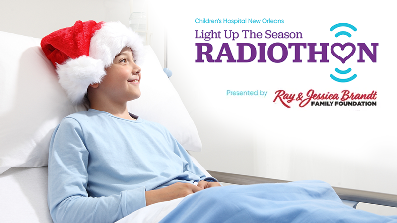 happy child with Santa hat in hospital bed