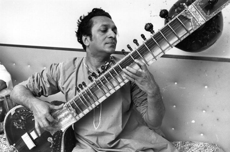 Ravi Shankar, the Indian composer and sitar player pictured playing