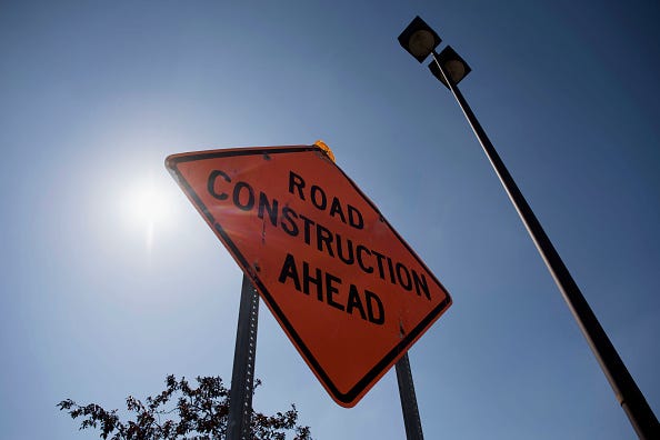 A sign warns drivers of road construction ahead