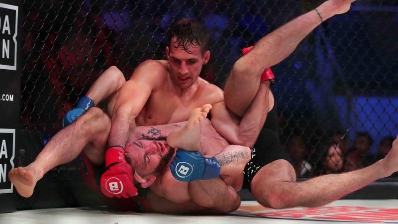 Rory Macdonald applies a hold to Jon Fitch during their welterweight fight at Bellator 220.