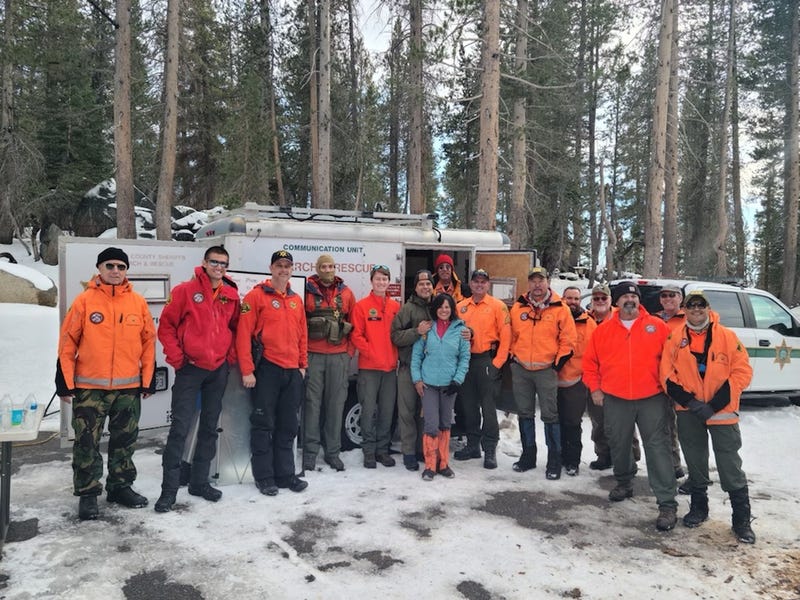 Jolly Bose with the search and rescue team that safely found her after she was missing for two days in the Sierra Mountains.