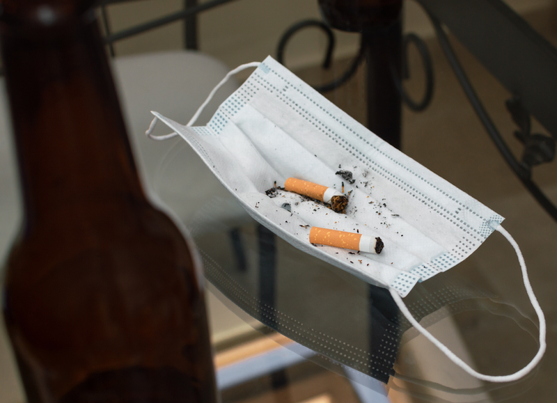 cigarette butts, beer bottle