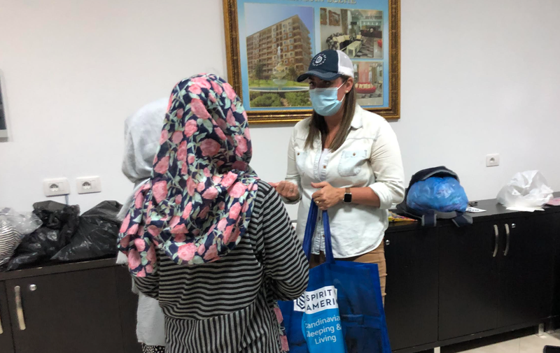 SoA handing out supplies to female scholars in our group