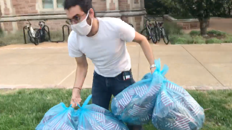Student removes flags
