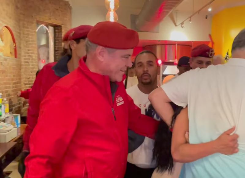 Patrons and members of the Guardian Angels, including Republican mayoral candidate Curtis Sliwa, attempt to break up a fight Friday night at Il Piccolo Buffalo in Little Italy.