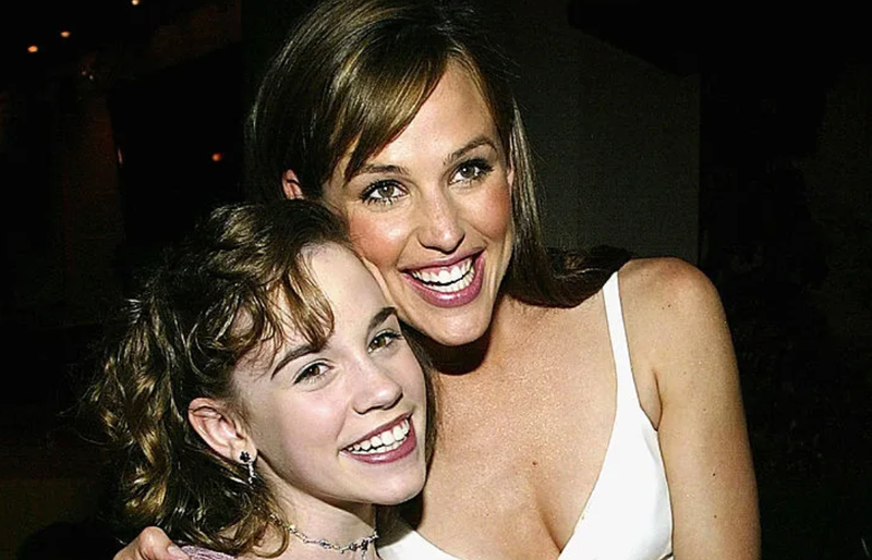 Actress Christa Allen (L) and actress Jennifer Garner hug at the after party for the film "13 going on 30" following the premiere of the film April 14, 2004 in Westwood, California. (Photo by Carlo Allegri/Getty Images)
