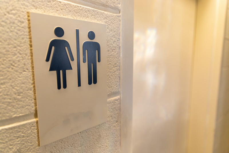 gender sign outside restroom