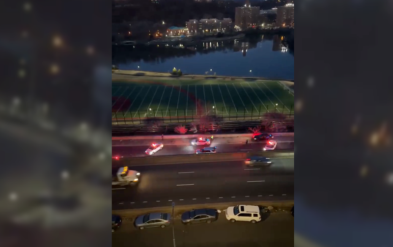 Police said a driver fired from a moving car on the Major Deegan Expressway early Friday, wounding a man in another car. Police were seen investigating at the scene before sunrise