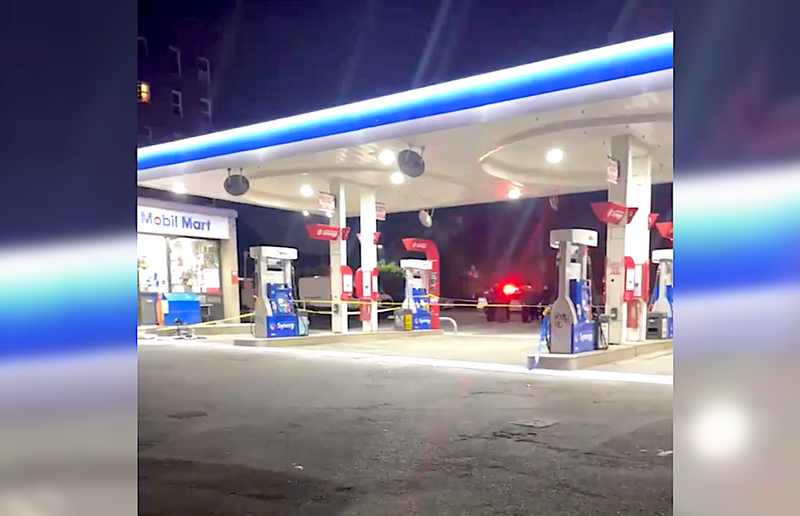 Police tape was up at the Mobil gas station on the Horace Harding Expressway in Corona on Thursday night