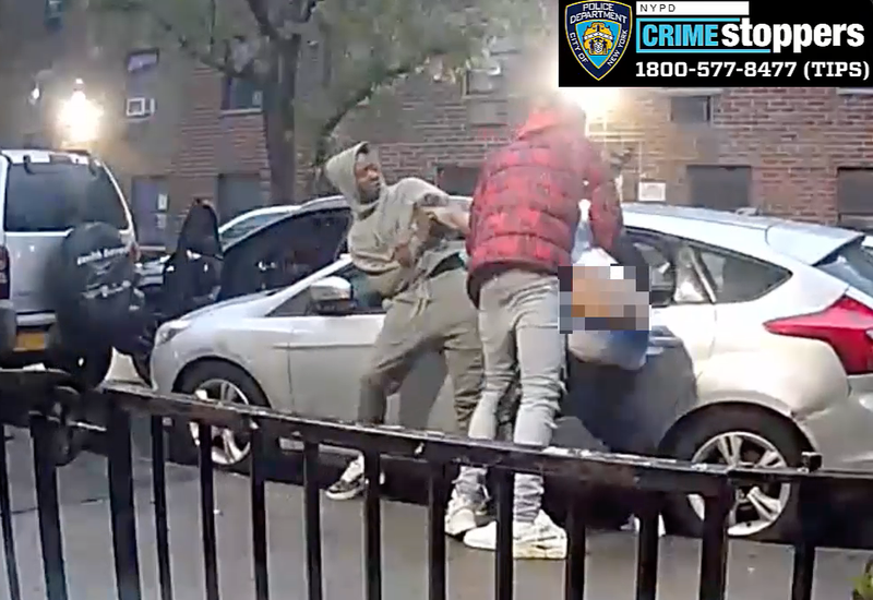 New video from police shows two males beating and stabbing a victim while robbing him in the Morrisania section of the Bronx on May 7