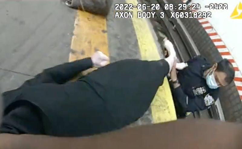 The officers pulled the woman from the tracks. She was taken to an area hospital in stable condition with a head injury