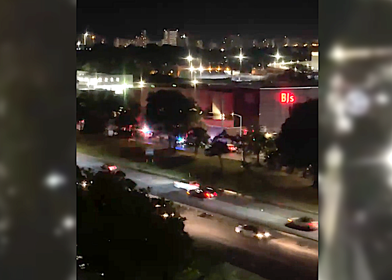 Police outside the BJ's following Thursday night's shooting
