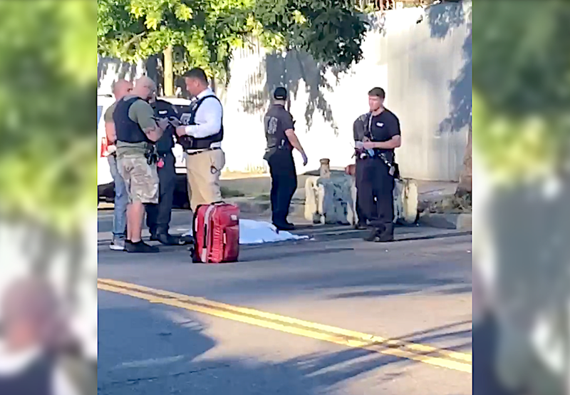 Police investigate at the scene of a fatal shooting in Far Rockaway on Monday evening