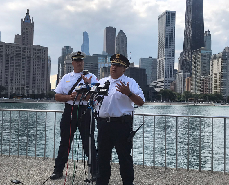 police official talking at lakefront
