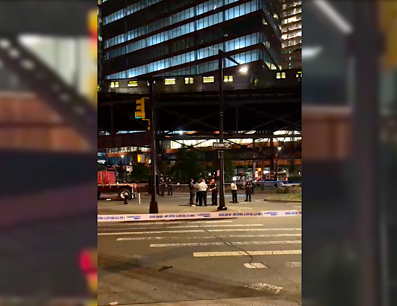 Police at the scene of the crash at Jackson Avenue and Queens Plaza South