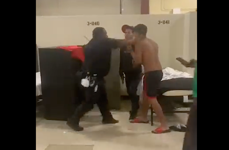 Video shot by a shelter resident reportedly shows a DHS police officer striking a resident on Wednesday morning