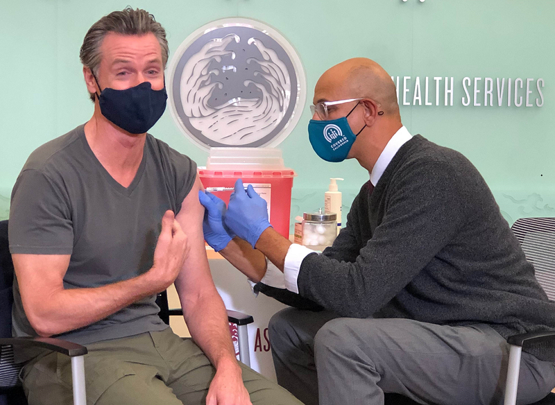 Gov. Gavin Newsom gets his COVID-19 booster shot at an event in Alameda County.