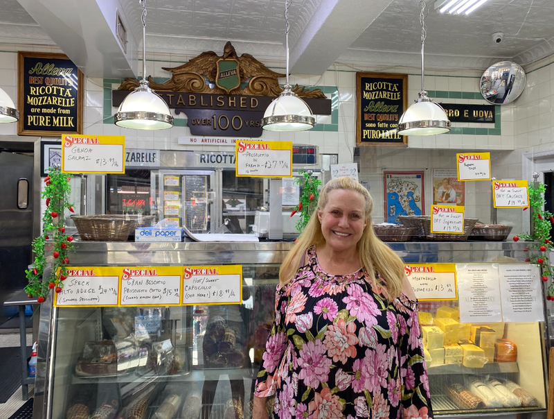 Karen King stands in front of the counter at Alleva Dairy.