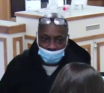 Suspect wearing a face mask