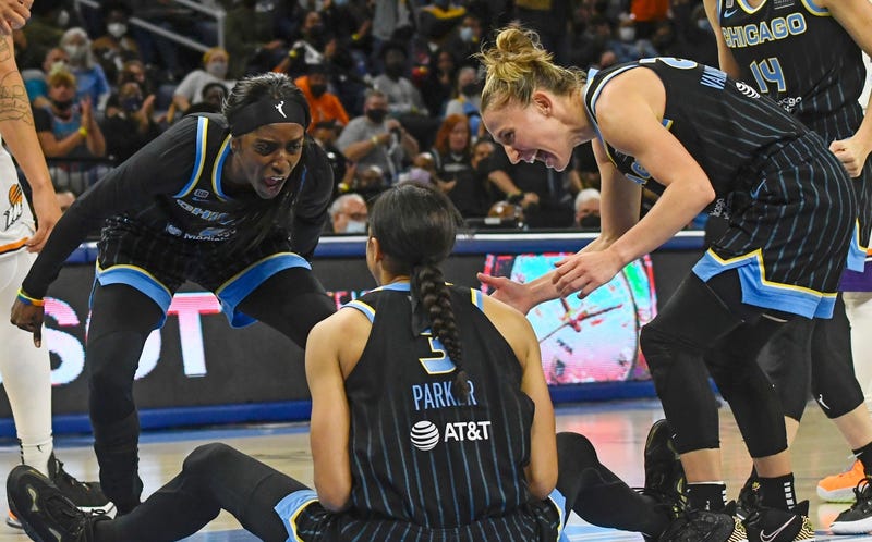 Sky guard/forward Kahleah Copper (2) and guard Courtney Vandersloot (22) yell at Candace Parker (3) in celebration during their eventual win against the Mercury in Game 4 of the WNBA Finals on Sunday. The win gave the Sky their their first championship.