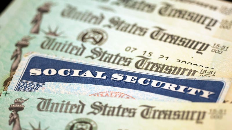 In this photo illustration, a Social Security card sits alongside checks from the U.S. Treasury on October 14, 2021 in Washington, DC.