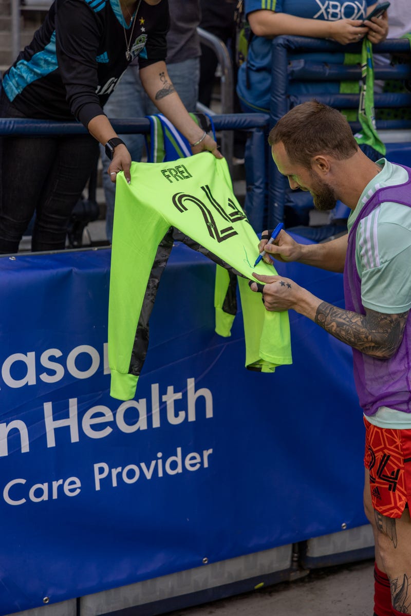Stefan Frei signing a keeper kit