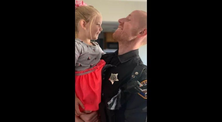 Bensenville Police Officer Steven Kotlewski with his 5-year-old daughter
