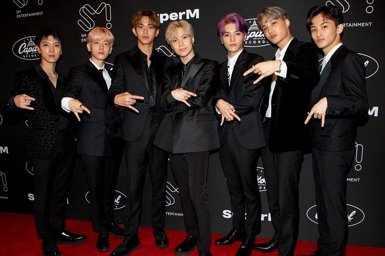 K-pop supergroup SuperM pose during a press conference at Capitol Records Hosts Release Of SuperM's Debut EP, The 1st Mini Album "SuperM" at Capitol Records Studio
