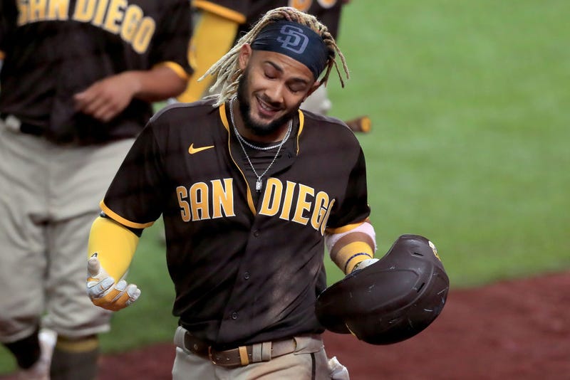 Fernando Tatis Jr. shrugs after hitting a home run