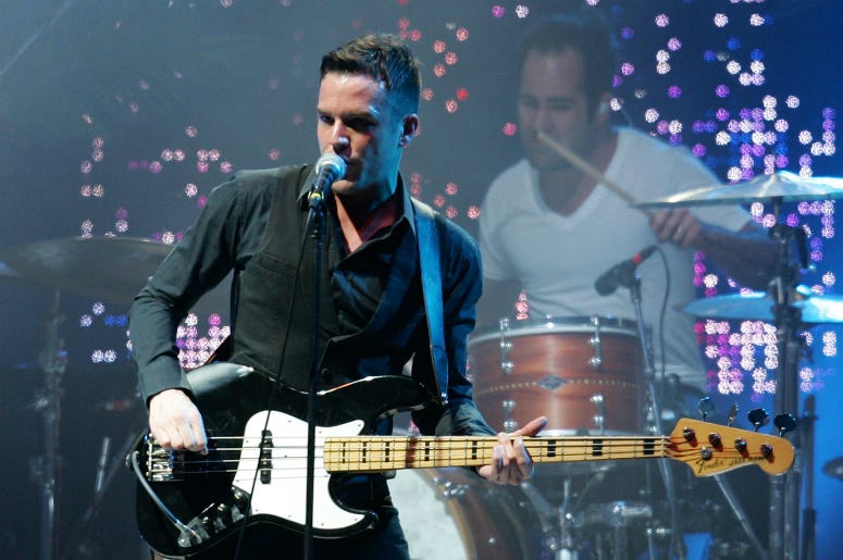 Ronnie Vannucci Jr (R) and Brandon Flowers of The Killers perform on stage at the Melbourne leg of the Good Vibrations music festival.