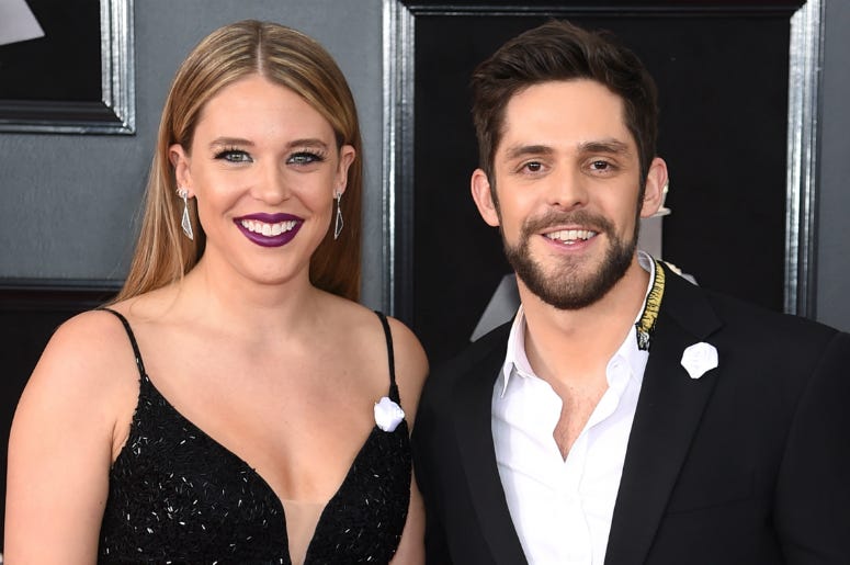 Lauren Akins (L) and reecording artist Thomas Rhett attend the 60th Annual GRAMMY Awards