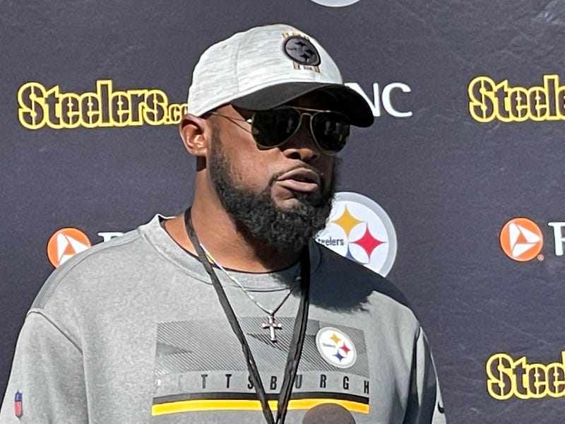 Mike Tomlin at podium outside