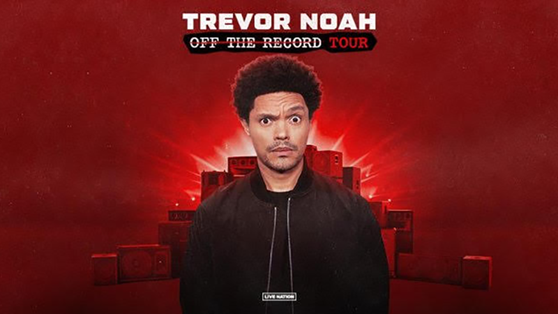 Trevor Noah on red background