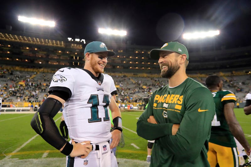 Carson Wentz (left) and the Eagles will face Aaron Rodgers (right) and the Green Bay Packers on Thursday Night Football.