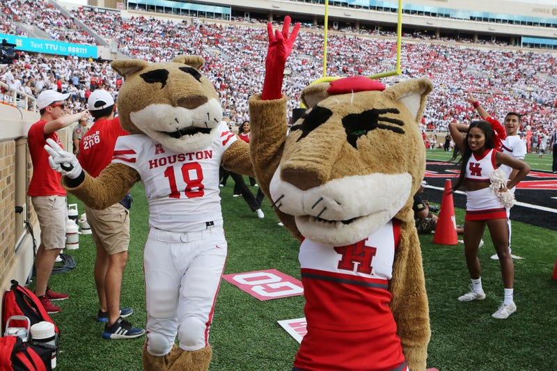 The Houston Cougars mascots entertain the crowd during the game against the Texas Tech Red Raiders at Jones AT&T Stadium.