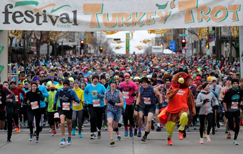 Racers set off from the start line of a turkey trot race