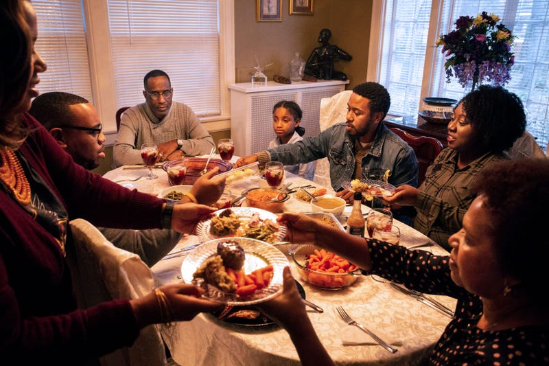 A family celebrates around a Thanksgiving table
