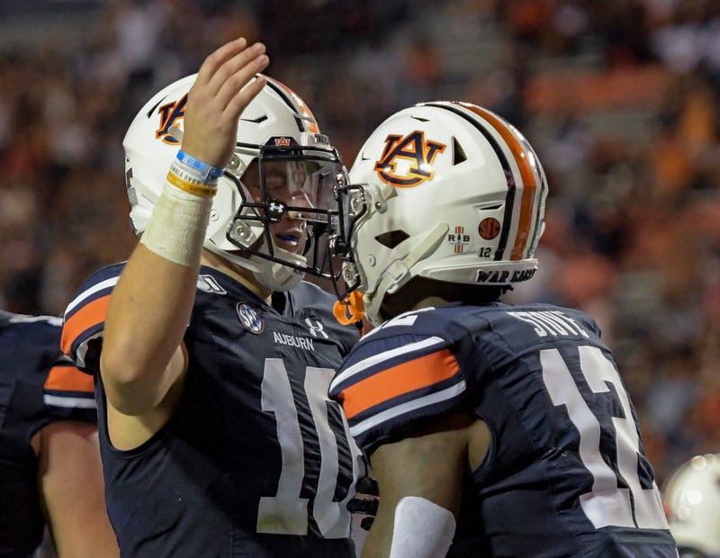 Auburn QB Bo Nix celebrates a touchdown with Eli Stove.