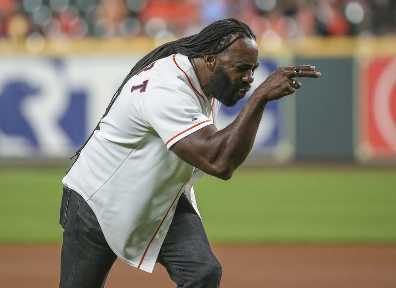 Former professional wrestler Booker T reacts after throwing out a ceremonial first pitch before a game between the Houston Astros and the Texas Rangers at Minute Maid Park