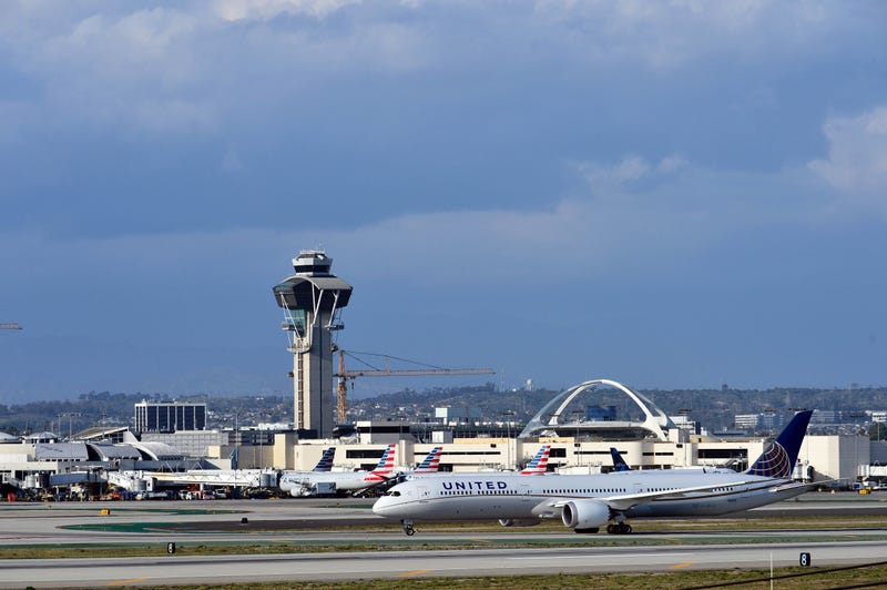 Woman Runs On The Tarmac To Catch Her Plane At LAX
