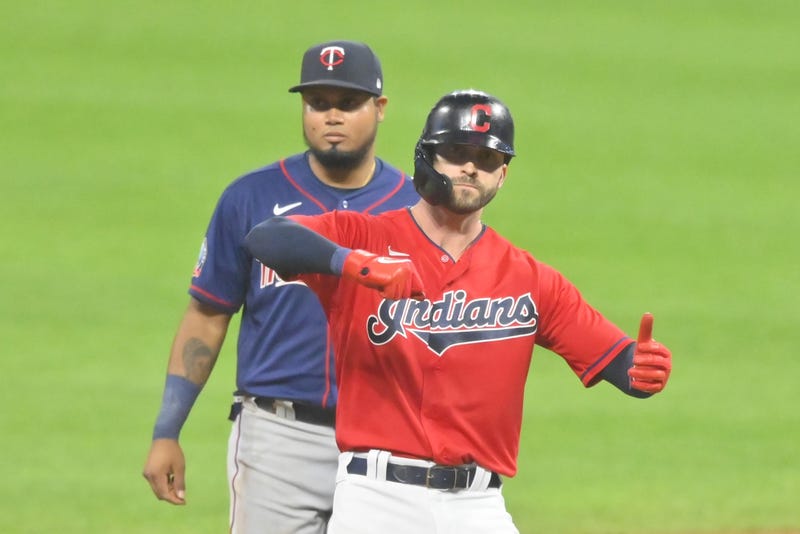 Cleveland Indians right fielder Tyler Naquin (30) celebrates his RBI double beside Minnesota Twins second baseman Luis Arraez (2) in the eighth inning at Progressive Field.