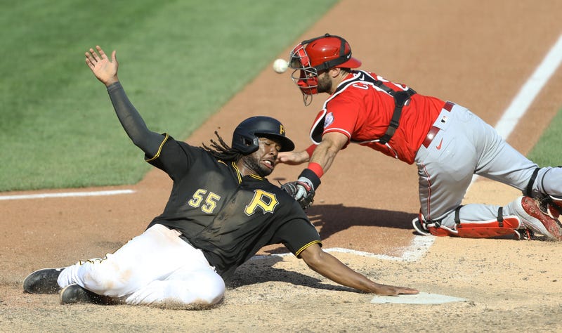 Josh Bell sliding into home