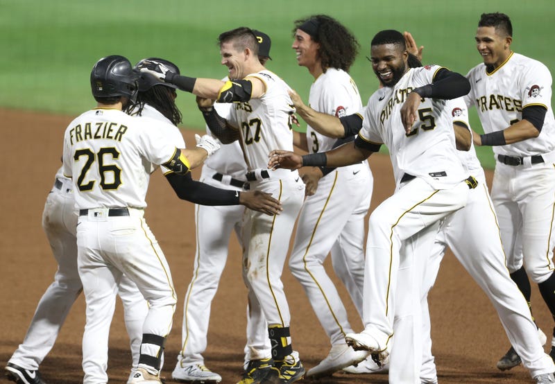 Pittsburgh Pirates shortstop Kevin Newman (27) celebrates with teammates after driving in the game winning run against the Chicago White Sox