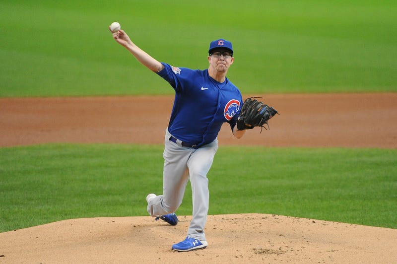 Cubs starter Alec Mills hurls a pitch toward home plate.