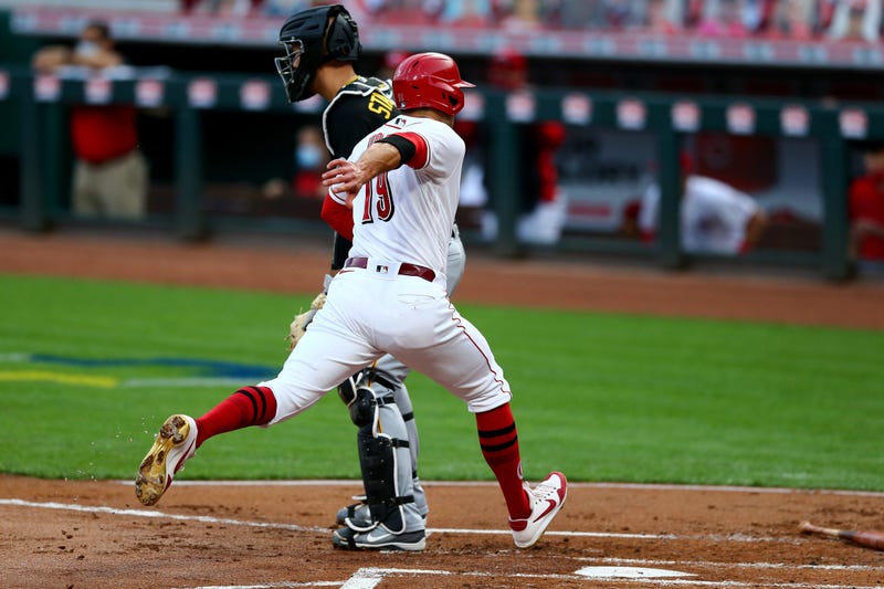 Cincinnati Reds first baseman Joey Votto (19) scores on a sacrifice fly